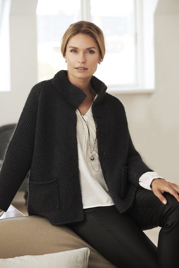 Alma black knitted wool cardigan or light jacket, made in Jensen Yarn and Silk Mohair, the front