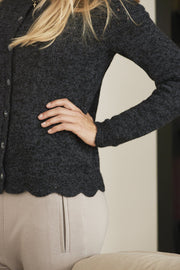 Annabelle knitted cardigan, black with fine details and buttons, detail picture of side and edge