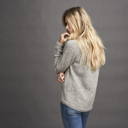Dagmar classic, knitted grey sweater with braids at the sides, made in Isager alpaca and spinni wool, the back