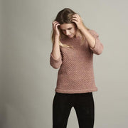 Dicte light knitted peach colored sweater with an elegant single color pattern, made in Isager Alapaca and Spinni wool, the front