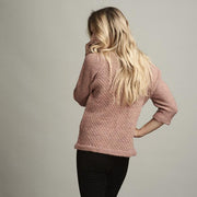 Dicte light knitted peach colored sweater with an elegant single color pattern, made in Isager Alapaca and Spinni wool, the back