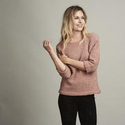 Dicte light knitted peach colored sweater with an elegant single color pattern, made in Isager Alapaca and Spinni wool, the front