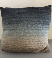 Knitted pillow with dip dye color change from blue to grey, knitted in Isager Spinni wool