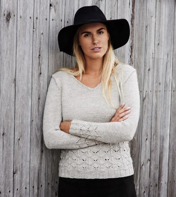 Becca light grey V-neck sweater with sea-shell lace pattern at the hem and sleeves, made in Isager Alpaca