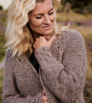 Beatrice long, cozy brown cardigan with smock pattern at hem, sleeves and pockets, made in Isager Alpaca and silk mohair